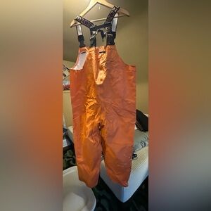 Orange GRUNDENS Small. 2 medium size paint stains. Still work fine